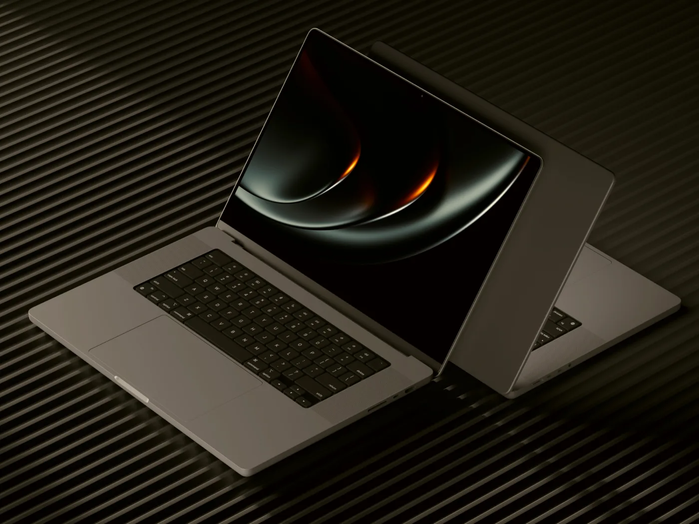 Two laptops showing responsive website layouts